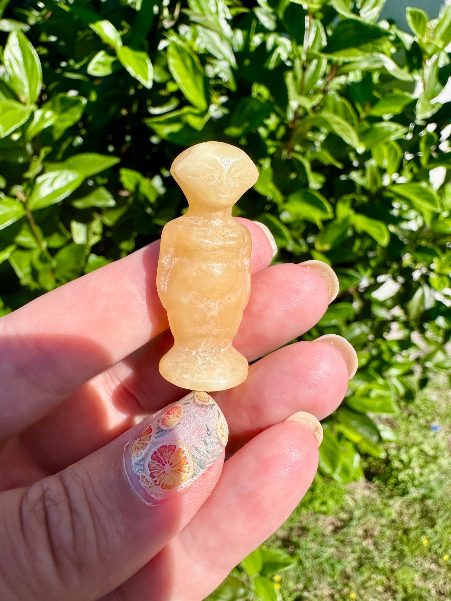 Yellow Calcite Alien Carving: Unique Handcrafted Extraterrestrial Figurine, Ideal for Sci-Fi Fans and Collectors of Novelty Crystal Decor