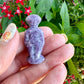 Lepidolite Alien Carving: Captivating Hand-Carved Extraterrestrial Figurine, Perfect for Collectors of Unique Mineral Decor and Sci-Fi Enthusiasts