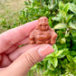 Gold Sandstone Buddha Carving: Serene Decor Piece, Reflective Glittering Finish, Ideal for Meditation Spaces, Unique Gift